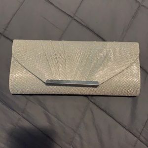Never used Call it Spring Clutch, sparkly silver with shoulder chain
